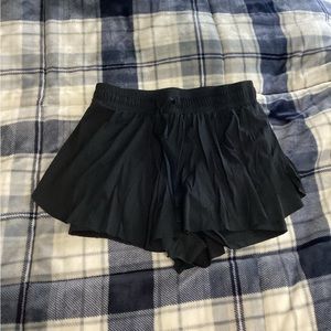 Flowy athletic skorts with built in shorts and a built in phone pocket